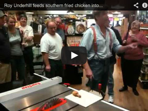 Roy Underhill feeds a chicken leg into a SawStop