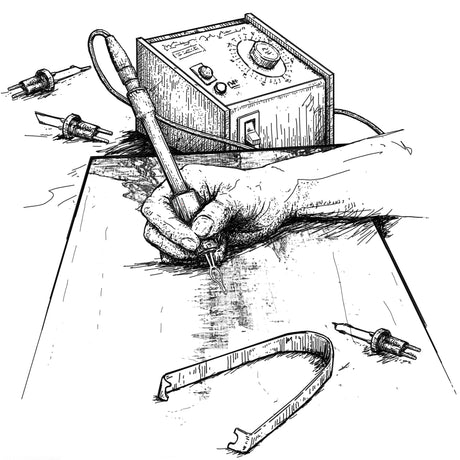 Using woodburning tools to create an image.